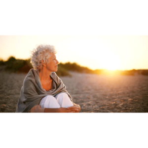 Elderly women seating on beach